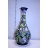 A large Moorcroft vase by Anji Davenport in the Wolfsbain pattern dated 2002. 54 cm tall. No