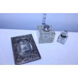 Two vintage inkwells and a vintage white metal photo frame