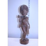 A hand carved oriental figure. 40cm tall.