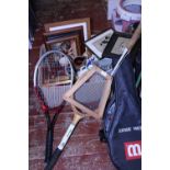 A box full of assorted collectables including sports rackets. Shipping unavailable