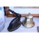 A brass bell and an antique franking machine
