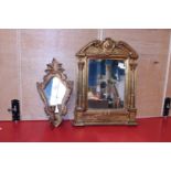 A gilt framed mirror and wall candle holder. Postage unavailable