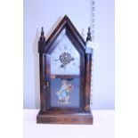 A early 20th century Gothic style mantel clock. a/f Postage unavailable