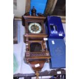 An antique Vienna wall clock in working order with pendulum and key. Postage unavailable