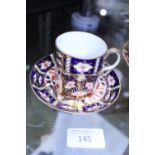 A Royal Crown Derby coffee cup and saucer pattern number 2451