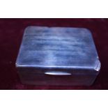 A hallmarked silver cigarette box with boxwood lining GW 303 grams (has damage)
