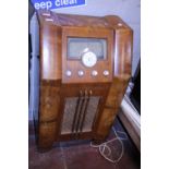A vintage wooden cased radiogram. Postage unavailable