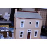 A dolls house fully furnished. Postage unavailable