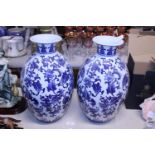 A pair of decorative blue and white vases h42cm