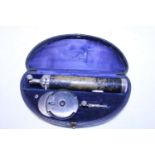 A cased vintage ophthalmoscope