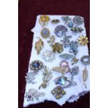 A job lot of vintage costume jewellery brooches