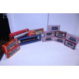A box of assorted boxed model railway carriages and wagons
