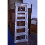 A pair of vintage wooden step ladders, shipping unavailable