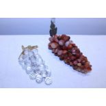 Two bunches of glass/marble grapes