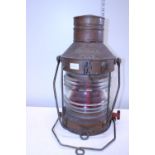 A antique 'Not under Command' ships lantern with red lens (Portside lantern)