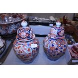 A pair of Oriental ginger jars with lids (chip to one lid)