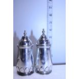 A pair of hallmarked Silver pepper pots 155g