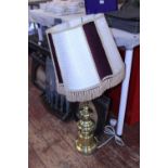 A large brass based table lamp, shipping unavailable