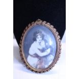 A antique framed and hand painted portrait on bone