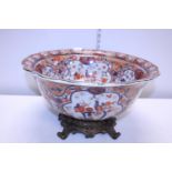 A large ceramic late 19th century bowl on a heavy brass stand d44cm, shipping unavailable