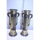 A pair of Art Noveau period brass vases