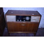 A vintage radio gram cabinet a/f. Postage unavailable