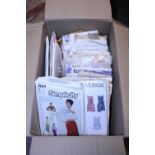 A box of vintage sewing patterns