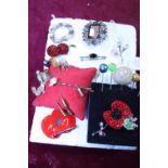 A selection of vintage brooches and stick pins etc