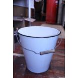 A vintage enamel bucket