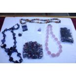 A selection of assorted natural stone costume jewellery including beads etc