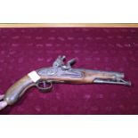 A antique flintlock pistol marked Tower 1798 (slight damage to grip)