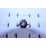 A hallmarked 9ct gold and white stone cluster ring