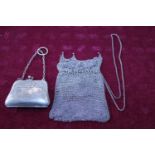 A silver plated ladies finger purse and a mesh coin purse