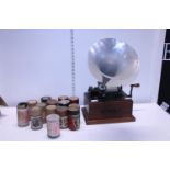A antique Thomas Edison phonograph complete with a selection of phonograph rolls