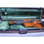 A 1970 Richard Reimal cased violin with two bows, chin rest and spare strings