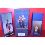 Three boxed military figures