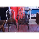 Two vintage wooden wheel back chairs, shipping unavailable