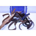 A selection of leather belts and other