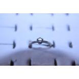A 18ct white gold diamond solitaire ring with .25carat