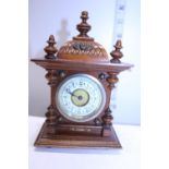 A vintage small wooden mantle clock with wind up movement (has been overwound) 17cm x 10cm