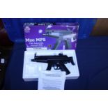 A boxed mini MP5 airsoft gun (unchecked)