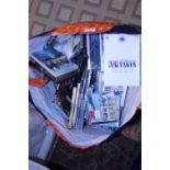 A large bag of DVD's and CD's