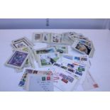 A job lot of assorted first day covers and postcards etc
