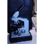 A vintage microsystem 70 microscope with case Shipping unavailable