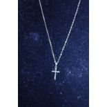 A 9ct gold chain and cross 1.14g