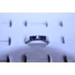 A 18ct gold diamond and sapphire ring