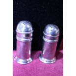 A pair of hallmarked silver pepper pots with blue liners gross weight 112.8g