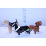 Three assorted Beswick dog figures