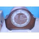 A wooden cased 1930's mantle clock, shipping unavailable