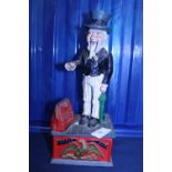 A vintage cast iron Uncle Sam moneybox